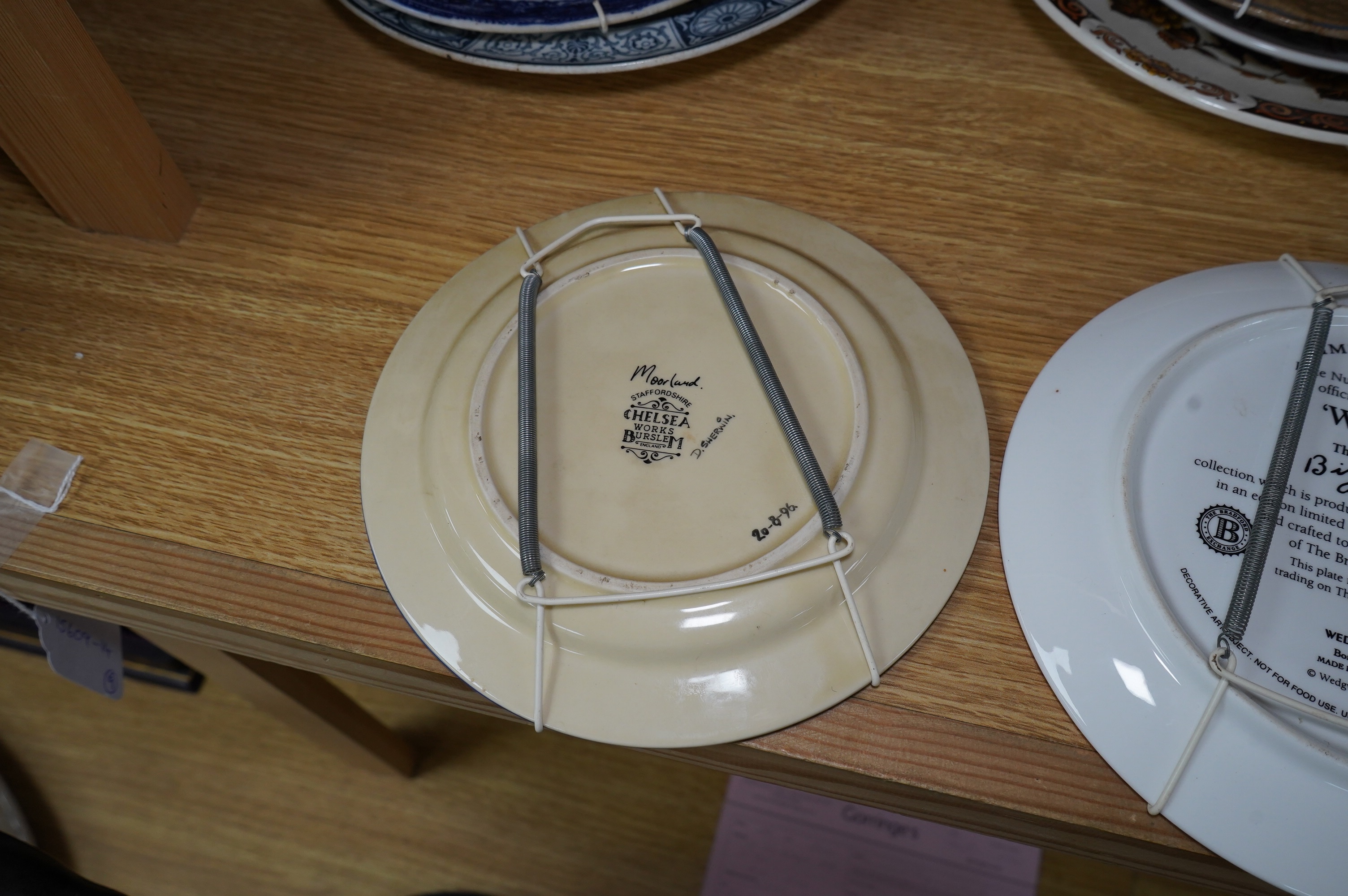 Nine various decorative wall plates including a Wedgwood limited edition ‘Windbells’ in the Bizarre living landscapes of Clarice Cliff plate, Chelsea Works Burslem, Limoges etc. Condition - mostly fair to good